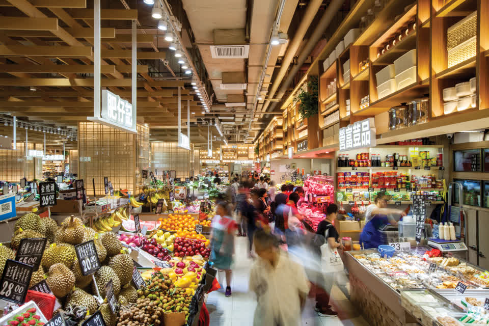 People walk around in the renovated Link REIT T Market to buy daily produce.